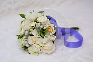Bride`s bouquet on the bed. wedding night. bride`s bouquet on the bed.flowers for wedding. bouquet for your favorite