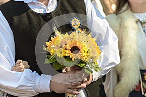 Bride's bouquet with sunflower, yellow chrysanthemums and green