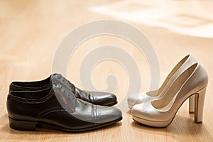 Bride's and groom's shoes photo