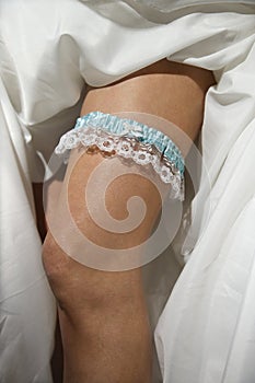 Bride's leg with garter.