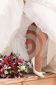 Brides legs with boquet