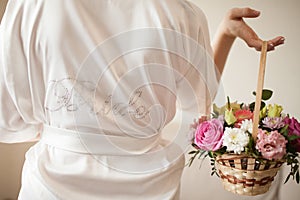 Bride`s morning, woman wearing silk dressing gown.