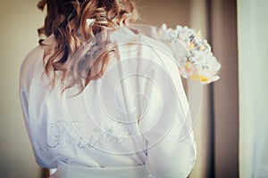 Bride`s morning, woman wearing silk dressing gown