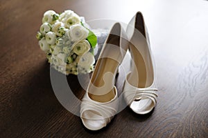 Bride's shoes with a lucky coin