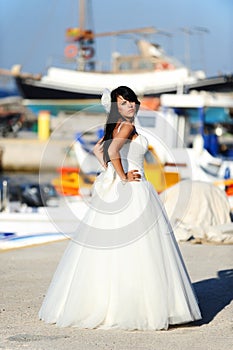 Bride in a Santorini harbor in GREECE