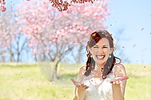 Bride Showered by Cherry Blossom Petals