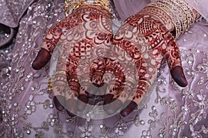 Bride showing mehndi in hands