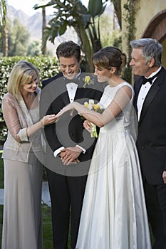 Bride Showing Wedding Ring To Mother