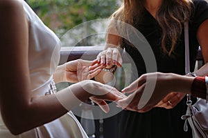 Bride shows her ring to friends