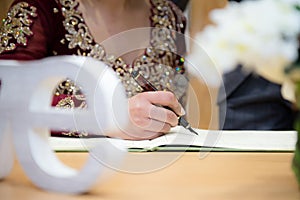 Bride signing
