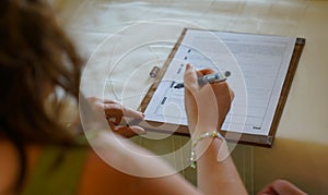 Bride signing for marriage in civil registry office