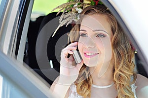 Bride sitting in a car