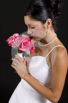 Bride smelling flower bouquet