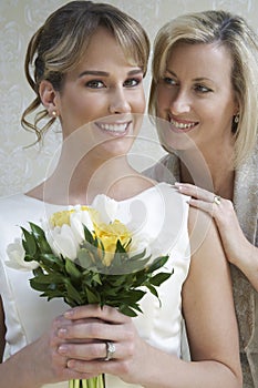 Bride Standing With Her Mother