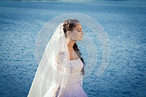 Bride standing near the river