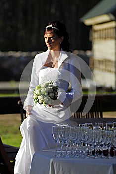 Bride standing over goblets