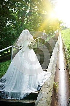 Bride standing on a staircase