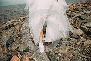 Bride style dress sneakers beach wet stones