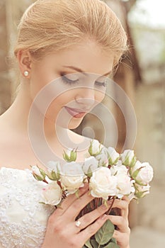 Bride with stylish make-up in white dress