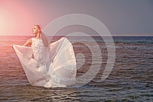 Bride on sunny summer day on blue water