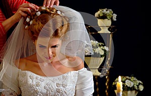 Bride thinking about choice of groom. Woman in wedding dress.