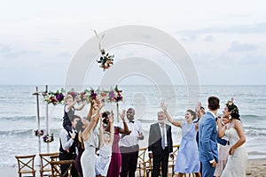 Bride throwing the bouquet at wedding