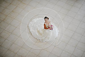 bride with tiara pose at the restauraunt.