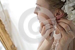 Bride to put the earrings