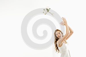 Bride tossing bouquet.
