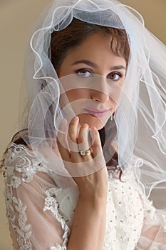 Bride in traditional white dress and veil