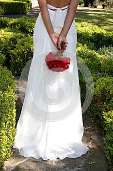 Bride Walking Away On Garden Walk