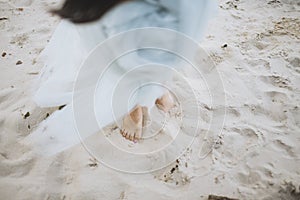 Bride walking barefoot.