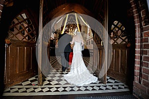 Bride walking down aisle with father