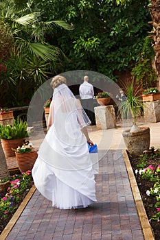 Bride walking to groom