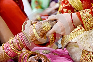 Bride wearing bangles hand closeup