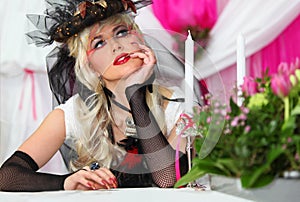 Bride wearing black net gloves and unusual hat