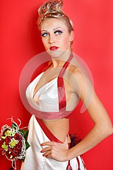 Bride wearing in dress with red ribbons