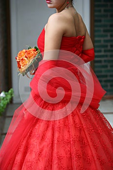 Bride, wearing silk red gown