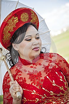 Bride wearing Vietnamese Ao Dai