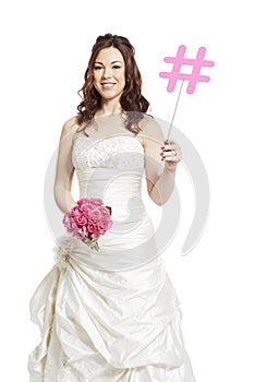 Bride wearing wedding dress holding a social media sign