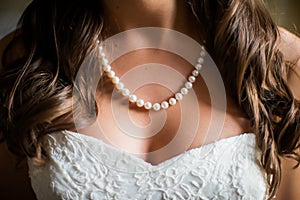 Bride wearing white pearl necklace