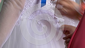 The bride wears a dress tighten ties