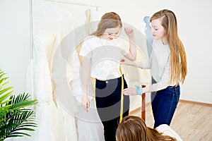 Bride with wedding assistant