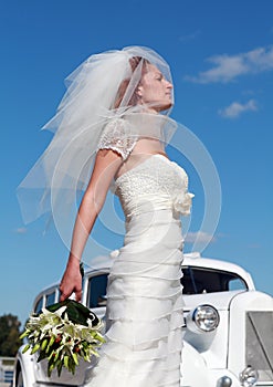 The bride and the wedding car