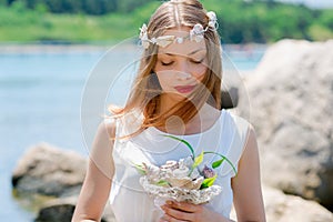 Bride with wedding crown and bouquet of seashels