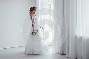 Bride in wedding dress with a bouquet of flowers