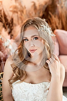 Bride in wedding dress. Young fashion model with perfect skin, make up and Beautiful Hairstyle. Happy day. Marriage.