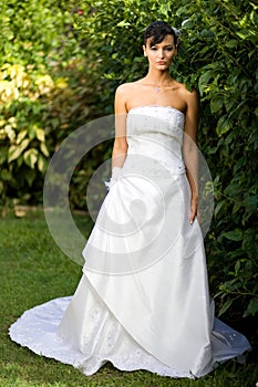 Bride in wedding gown outside
