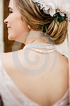 Bride with wedding makeup and hairstyle. Smiling bride. Wedding