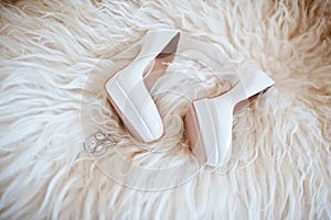 Bride wedding shoes with high heels and silver brilliant earring